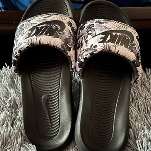 Black and white Nike slides